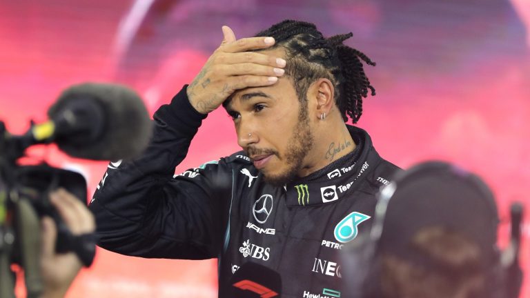 Mercedes driver Lewis Hamilton of Britain reacts after finishing second in the Formula One Abu Dhabi Grand Prix in Abu Dhabi, United Arab Emirates, Sunday, Dec. 12. 2021. Max Verstappen ripped a record eighth title away from Lewis Hamilton with a pass on the final lap of the Abu Dhabi GP to close one of the most thrilling Formula One seasons in years as the first Dutch world champion. (Kamran Jebreili, Pool/AP Photo) 

