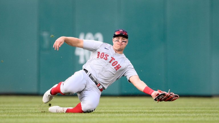 Boston Red Sox center fielder Hunter Renfroe makes a catch for an out on a fly ball hit by Washington Nationals' Alcides Escobar during the seventh inning of a baseball game, Saturday, Oct. 2, 2021, in Washington (Nick Wass/AP).