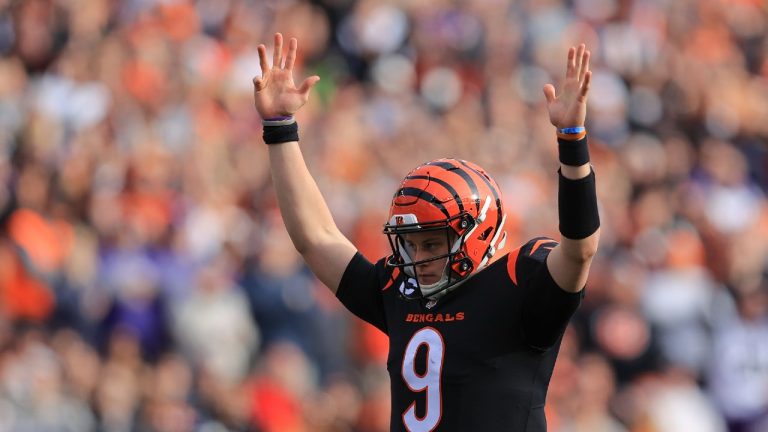 Cincinnati Bengals quarterback Joe Burrow (9) reacts after a touchdown run by Joe Mixon during the first half of an NFL football game against the Baltimore Ravens, Sunday, Dec. 26, 2021, in Cincinnati (Aaron Doster/AP).