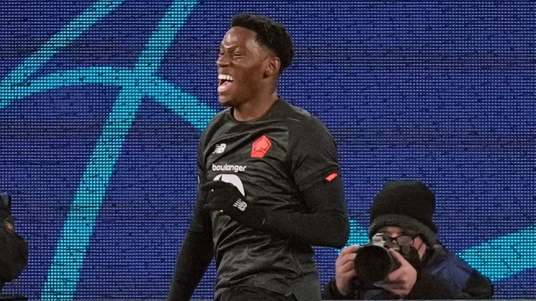 Lille's Jonathan David celebrates after scoring his side's second goal during the Champions League group G soccer match between VfL Wolfsburg and Lille OSC in Wolfsburg, Germany, Wednesday, Dec. 8, 2021. (Martin Meissner/AP Photo)