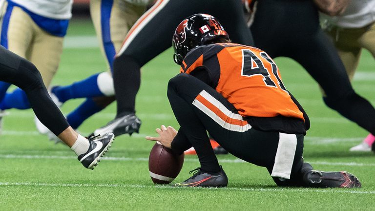 B.C. Lions' Jimmy Camacho (39) kick a 49 yard field goal as Stefan Flintoft (41) holds during the first half of a CFL football game against the Winnipeg Blue Bombers in Vancouver, on Friday, October 1, 2021. (Darryl Dyck/CP)