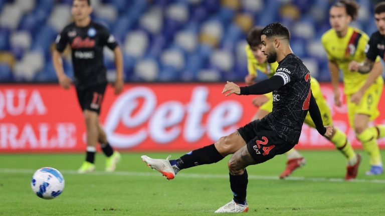 Napoli's Lorenzo Insigne scores his side's third goal on a penalty kick during the Italian Serie A soccer match between Napoli and Bologna at the Diego Armando Maradona stadium in Naples, Italy, Thursday, Oct. 28, 2021. (Alessandro Garofalo/LaPresse via AP)