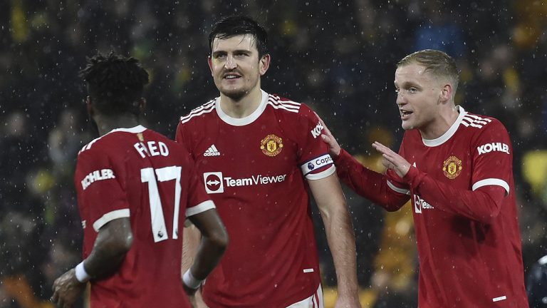 Manchester United's Harry Maguire, centre and Donny van der Beek, right, reacts alongside Fred. (Rui Vieira/AP)