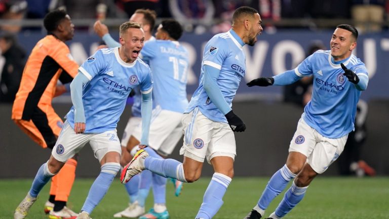 New York City FC players celebrate after defeating the New England Revolution in an MLS playoff soccer match Tuesday, Nov. 30, 2021, in Foxborough, Mass. (Charles Krupa/AP)
