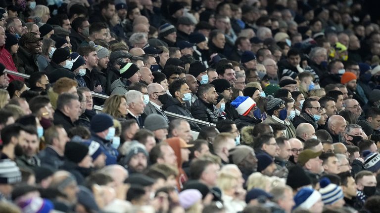 Tottenham fans watch the English Premier League soccer match between Tottenham Hotspur and Liverpool. (Frank Augstein/AP)