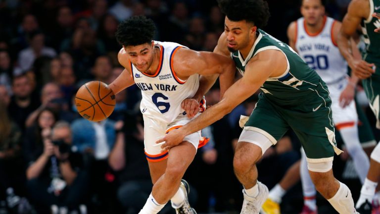 New York Knicks guard Quentin Grimes (6) drives to the basket against Milwaukee Bucks forward Jordan Nwora, front right, during the first half of an NBA basketball game in New York, Sunday, Dec. 12, 2021. (Noah K. Murray/AP) 