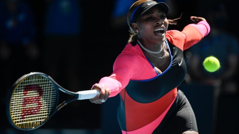 United States' Serena Williams hits a forehand return to Japan's Naomi Osaka during their semifinal match at the Australian Open tennis championship in Melbourne, Australia, Thursday, Feb. 18, 2021 (Andy Brownbill/AP).