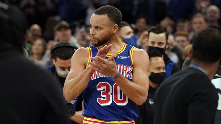 Golden State Warriors guard Stephen Curry reacts after scoring a three-point basket during the first half of an NBA basketball game against the New York Knicks. Curry hit his 2,974th career three-pointer Tuesday night, breaking the record set by Ray Allen. (Mary Altaffer/AP)
