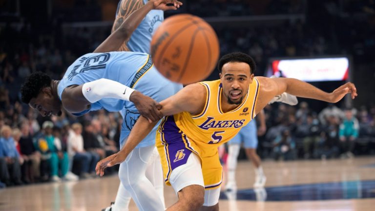 Memphis Grizzlies forward Jaren Jackson Jr. (13) and Los Angeles Lakers guard Talen Horton-Tucker (5) lose control of the ball during the first half of an NBA basketball game Thursday, Dec. 9, 2021, in Memphis, Tenn. (Nikki Boertman/AP) 