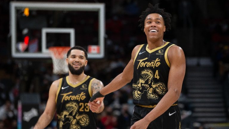 Toronto Raptors' Scottie Barnes (right) reacts with teammate Fred VanVleet during second half NBA basketball action against the Golden State Warriors. (Chris Young/CP)