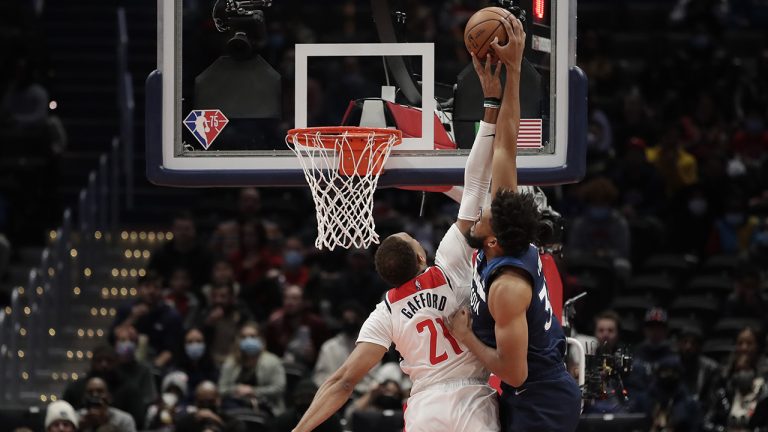 Minnesota Timberwolves' Karl-Anthony Towns, right, is fouled by Washington Wizards' Daniel Gafford. (Luis M. Alvarez/AP)