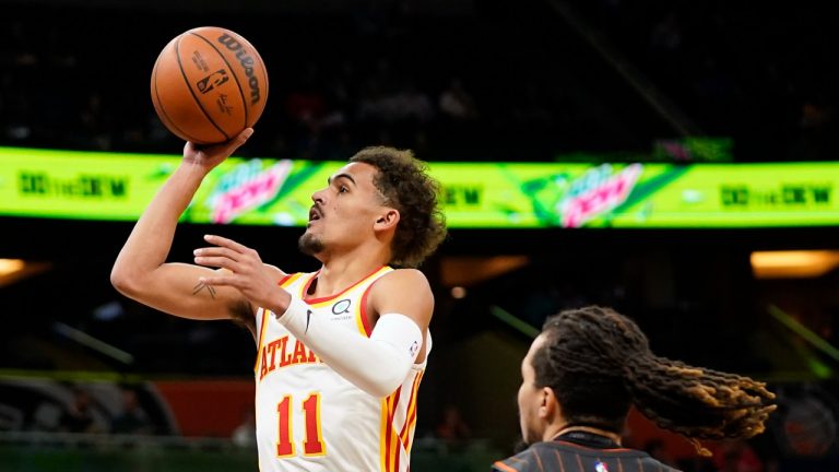 Atlanta Hawks guard Trae Young (11) takes a shot as he get past Orlando Magic guard Cole Anthony (50) during the first half of an NBA basketball game, Wednesday, Dec. 15, 2021, in Orlando, Fla (John Raoux/AP).