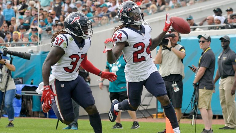Houston Texans cornerback Tremon Smith (24) celebrates his 98-yard touchdown run on a kickoff return against the Jacksonville Jaguars with cornerback Tavierre Thomas (37) as he crosses the goal line during the first half of an NFL football game, Sunday, Dec. 19, 2021, in Jacksonville, Fla (Phelan M. Ebenhack/AP).