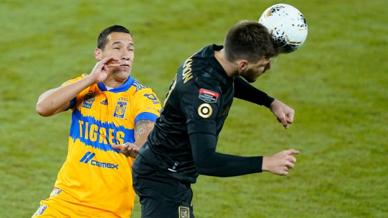 Los Angeles FC defender Tristan Blackmon, right, clears the ball away from Tigres midfielder Jesus Duenas (29) during the first half of a CONCACAF Champions League soccer match Tuesday, Dec. 22, 2020, in Orlando, Fla (John Raoux/AP).