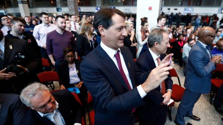 David Blitzer, centre, co-owner of the New Jersey Devils, uses a cell phone to record video during a news conference announcing Prudential Center as host of the Grammy Museum Experience, Tuesday, Feb. 7, 2017, in Newark, N.J. (Julio Cortez/AP) 