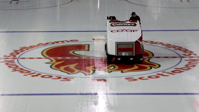 A Zamboni crosses over the Calgary Flames logo at the Saddledome. (CP Photo)
