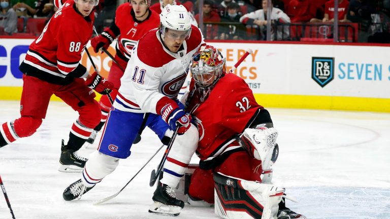 Montreal Canadiens' Brendan Gallagher (11) has his shot blocked by Carolina Hurricanes goaltender Antti Raanta (32) during the first period of an NHL hockey game in Raleigh, N.C., Thursday, Dec. 30, 2021. (Karl B DeBlaker/AP PHOTO) 
