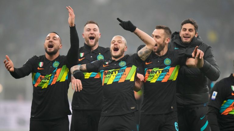 Inter Milan players celebrate after winning the Serie A soccer match between Inter Milan and Torino at the San Siro Stadium, in Milan, Italy, Wednesday, Dec. 22, 2021. Inter Milan won 1-0. (Luca Bruno/AP)