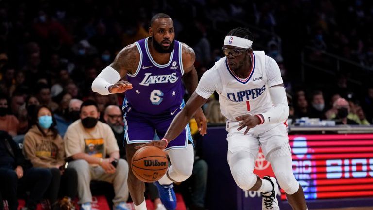 Los Angeles Lakers forward LeBron James (6) defends against Los Angeles Clippers guard Reggie Jackson (1) during the first half of an NBA basketball game in Los Angeles, Friday, Dec. 3, 2021. (Ashley Landis/AP)