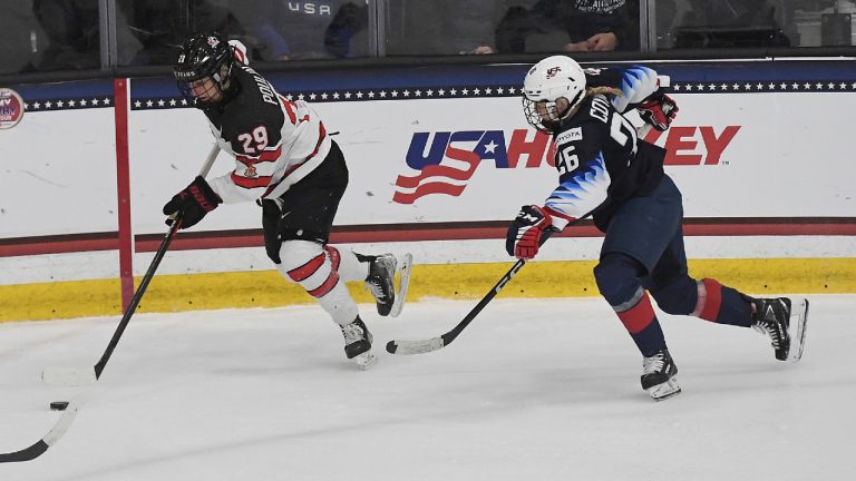 Canada's Marie-Philip Poulin (29) works the puck against United States' Kendall Coyne Schofield (26) during the second period of a women's exhibition hockey game ahead of the Beijing Olympics, Friday, Dec. 17, 2021, in Maryland Heights, Mo. (Michael Thomas/AP)
