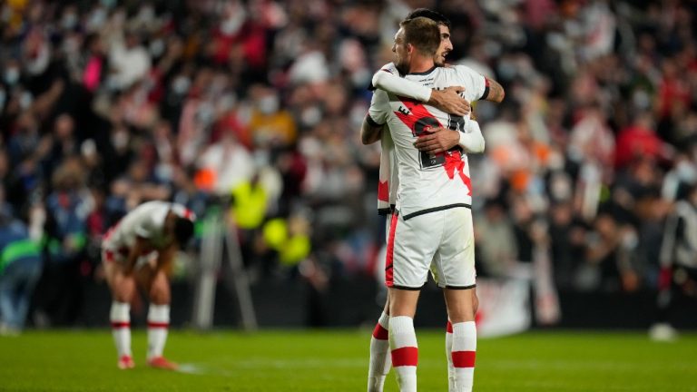 Rayo's Esteban Saveljich, foreground, celebrates with his teammate at the end of the Spanish La Liga soccer match between Rayo Vallecano and FC Barcelona at the Vallecas stadium in Madrid, Spain, Wednesday, Oct. 27, 2021. Rayo Vallecano won 1-0. (Manu Fernandez/AP)