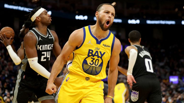 Golden State Warriors guard Stephen Curry yells after scoring against the Sacramento Kings during the second half of an NBA basketball game. (Jed Jacobsohn/AP)