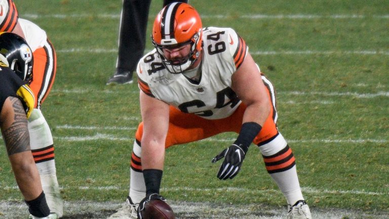 In this Jan. 10, 2021, file photo, Cleveland Browns center JC Tretter (64) snaps the ball during the first half of an NFL wild-card playoff football game against the Pittsburgh Steelers in Pittsburgh. (Don Wright/AP) 