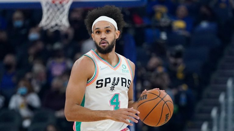 San Antonio Spurs guard Derrick White (4) dribbles up the court against the Golden State Warriors during the first half of an NBA basketball game in San Francisco, Saturday, Dec. 4, 2021. (Jeff Chiu/AP)