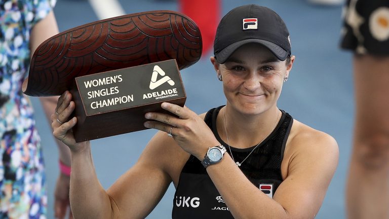 Ash Barty of Australia celebrates victory with the trophy after winning over Elena Rybakina of Kazakhstan in the final of the the Adelaide International Tennis Tournament. (Matt Turner/AAP Image via AP)