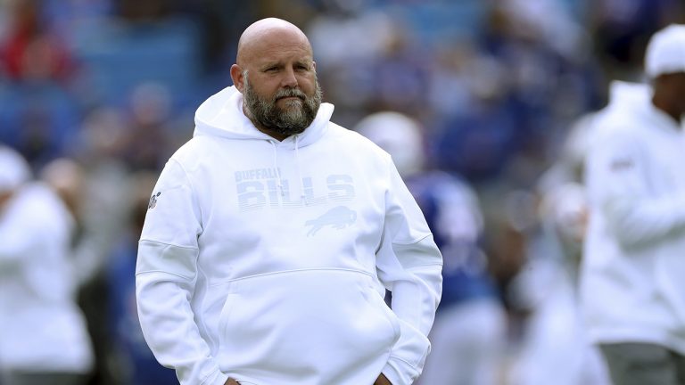 FILE - In this Sept. 29, 2019, file photo, Buffalo Bills offensive coordinator Brian Daboll watches the team warm up for an NFL football game against the New England Patriots. (Ron Schwane, File/AP)