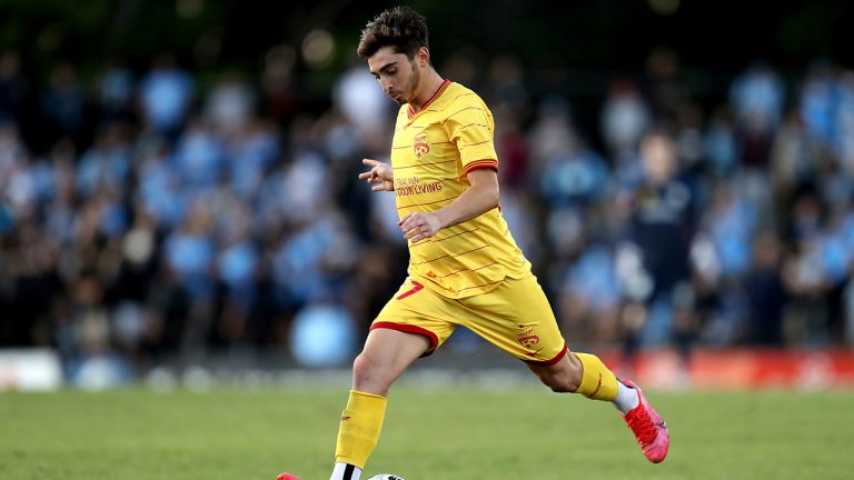 Josh Cavallo of the Adelaide United controls the ball during an A-League match between Sydney FC and Adelaide United in Sydney, on April 18, 2021. Cavallo came out in a series of social media posts and made comments about his experience in a video released Wednesday, Oct. 27, 2021, by his A-League club. Cavallo says he's the first active male player in the A-League to come out as gay. (Brendon Thorne/AAP Image via AP)