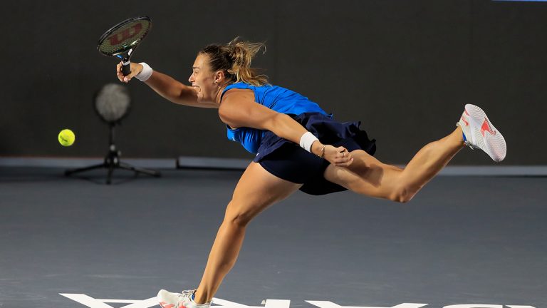 Aryna Sabalenka of Belarus returns the ball while playing Paula Badosa, of Spain, during the Mexican Tennis WTA Finals in Guadalajara, Mexico, Thursday, Nov. 11, 2021. (Refugio Ruiz/AP)