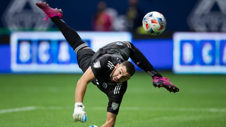 The ball deflects back off the post after Vancouver Whitecaps goalkeeper Maxime Crepeau made a diving save against Real Salt Lake during first half MLS soccer action in Vancouver, B.C., Sunday, Aug. 29, 2021. (Darryl Dyck/CP)