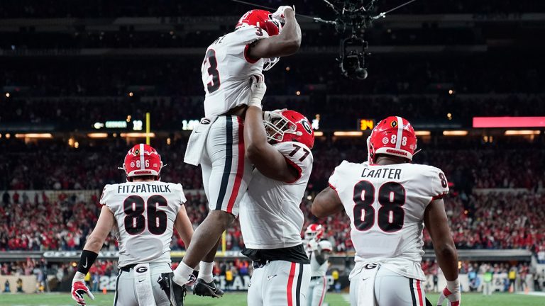 Georgia's Zamir White is congratulated after running for a touchdown during the second half of the College Football Playoff championship football game against Alabama Monday, Jan. 10, 2022, in Indianapolis. (Paul Sancya/AP)