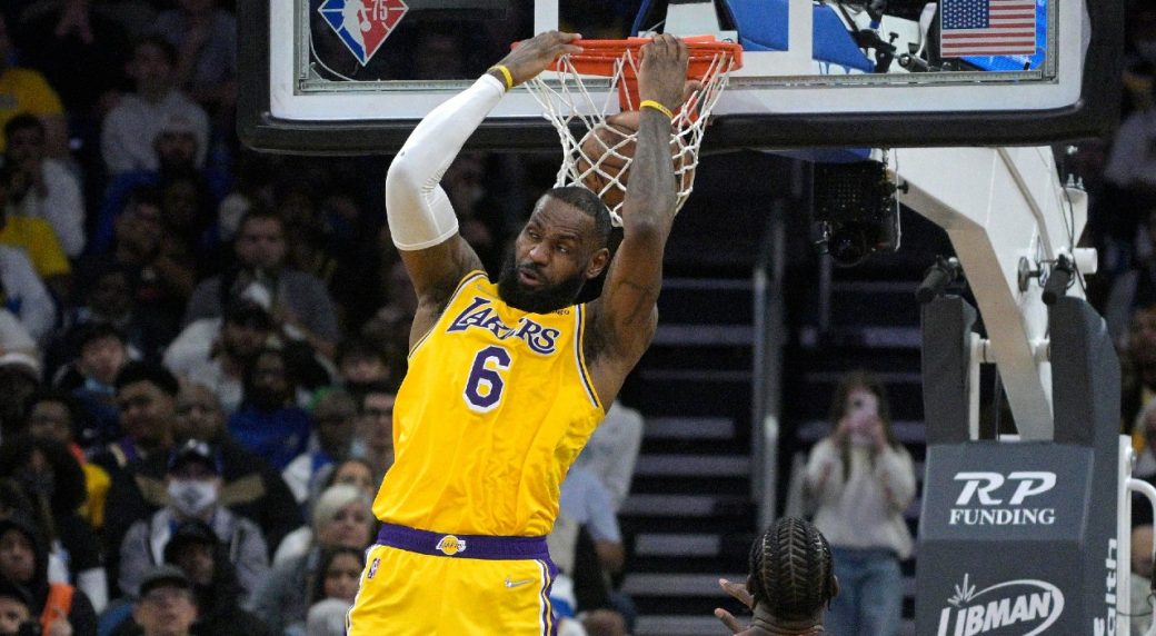 LeBron James soars for a dunk over Dwight Howard 