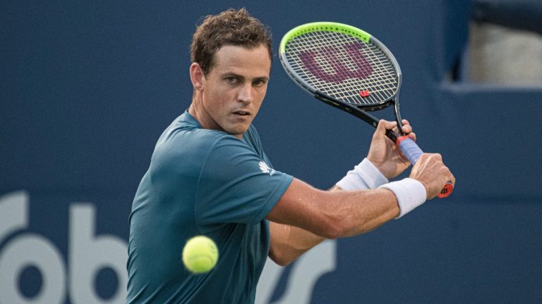 Canada’s Vasek Pospisil returns the ball to the United States' Tommy Paul during National Bank Open men's tennis action, in Toronto, Monday, Aug. 9, 2021. (Christopher Katsarov/CP)