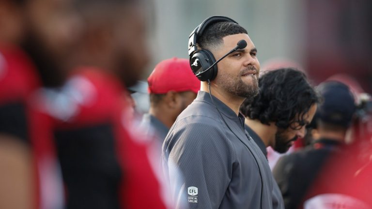 Calgary Stampeders defensive line coach Corey Mace takes to the field during CFL pre-season football action in Calgary, Friday, May 31, 2019. (Jeff McIntosh/CP) 