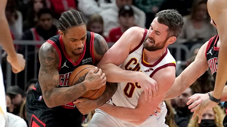 Chicago Bulls' DeMar DeRozan, left, steals the ball from Cleveland Cavaliers' Kevin Love during the second half of an NBA basketball game Wednesday, Jan. 19, 2022, in Chicago. (Charles Rex Arbogast/AP) 