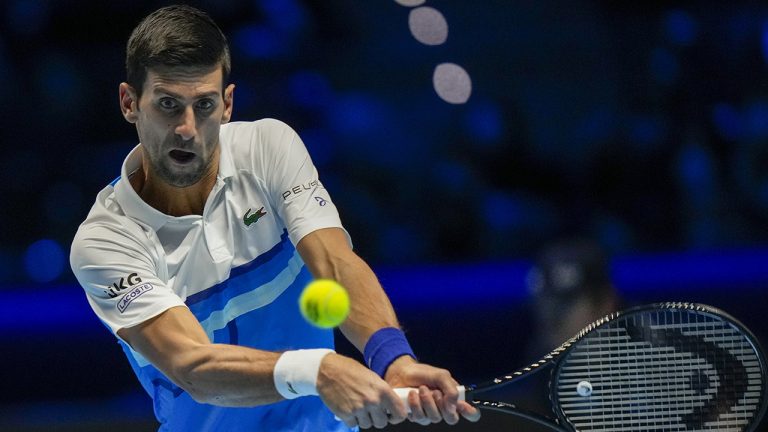 Serbia's Novak Djokovic returns the ball to Britain's Cameron Norrie during their ATP World Tour Finals singles tennis match, at the Pala Alpitour in Turin, Friday, Nov. 19, 2021. (Luca Bruno/AP)