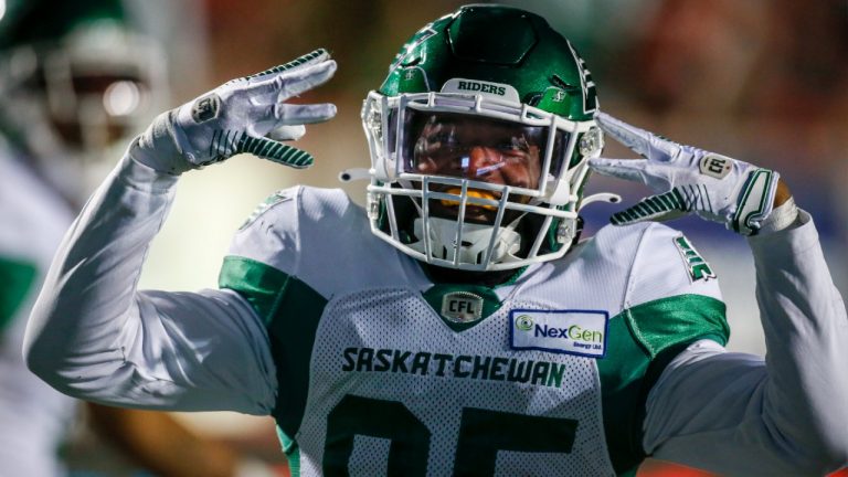 Saskatchewan Roughriders' Kyran Moore celebrates his touchdown during second half CFL football action against the Saskatchewan Roughriders in Calgary, Saturday, Oct. 23, 2021.(Jeff McIntosh/CP)