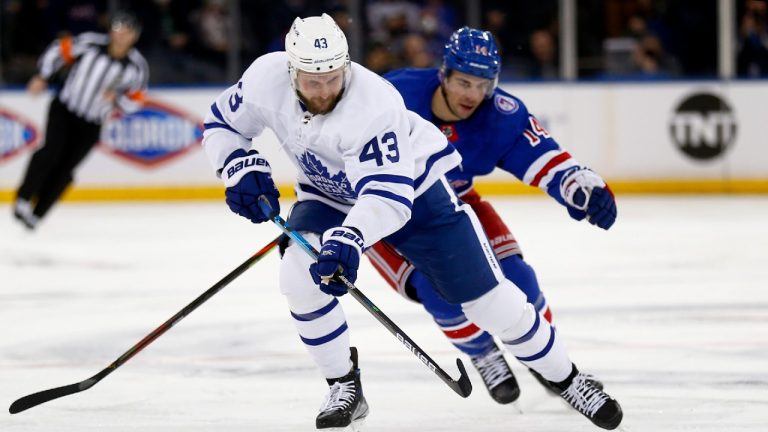 Toronto Maple Leafs' Kyle Clifford (43) skates up ice with New York Rangers' Greg McKegg (14) in pursuit during the first period of an NHL hockey game Wednesday, Jan. 19, 2022, in New York. (John Munson/AP)