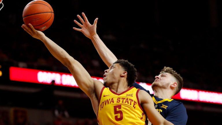 Iowa State guard Lindell Wigginton (5) drives to the basket past West Virginia guard Chase Harler during the second half of an NCAA college basketball game Wednesday, Jan. 30, 2019, in Ames, Iowa. (Charlie Neibergall/AP) 