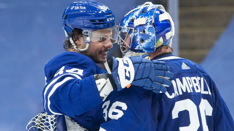 Auston Matthews and Jack Campbell of the Toronto Maple Leafs celebrate after a win. (Chris Young/CP)