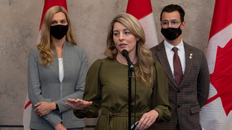 Minister of Sport Pascale St-Onge and former Olympic medalist and Liberal MP for Milton Adam van Koeverden listen to Foreign Affairs Minister Melanie Joly as she talks about a diplomatic boycott of the Winter Games in China following caucus, Wednesday, December 8, 2021 in Ottawa. (Adrian Wyld/CP)