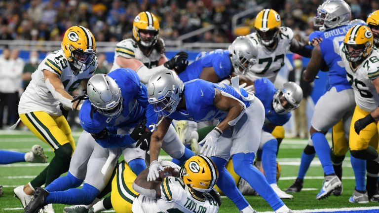 Green Bay Packers running back Patrick Taylor rushes for a 1-yard touchdown during the second half of an NFL football game against the Detroit Lions, Sunday, Jan. 9, 2022, in Detroit. (Lon Horwedel/AP) 