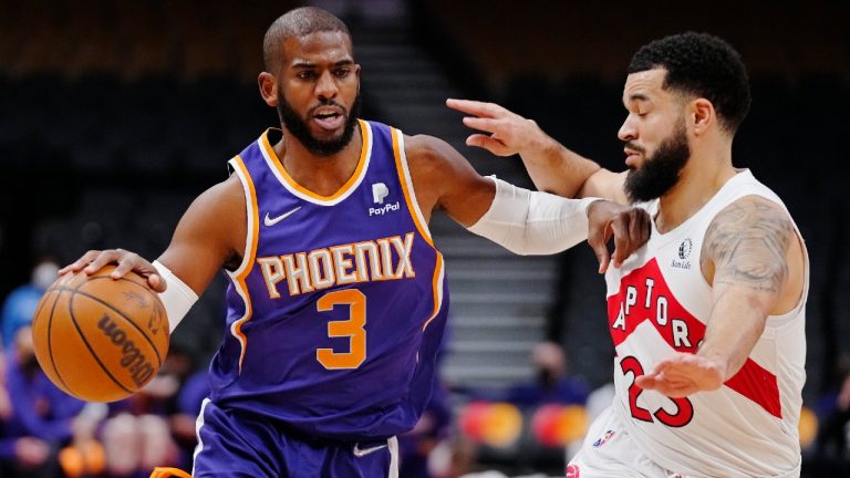 Phoenix Suns guard Chris Paul (3) protects the ball from Toronto Raptors guard Fred VanVleet (23) during first half NBA basketball action in Toronto on Tuesday, January 11, 2022. (Frank Gunn/CP)