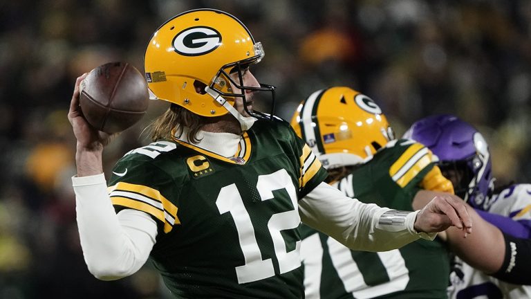 Green Bay Packers' Aaron Rodgers thorws during the first half of an NFL football game against the Minnesota Vikings. (Morry Gash/AP)