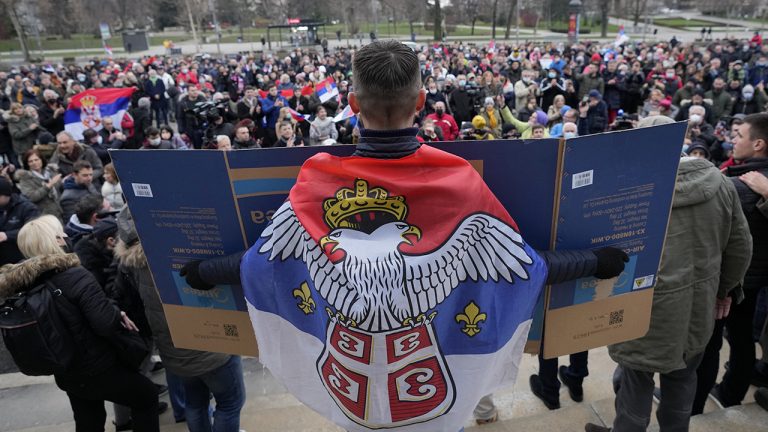 Supporters of Serbia's Novak Djokovic gather to protest in Belgrade, Serbia. (Darko Vojinovic/AP)