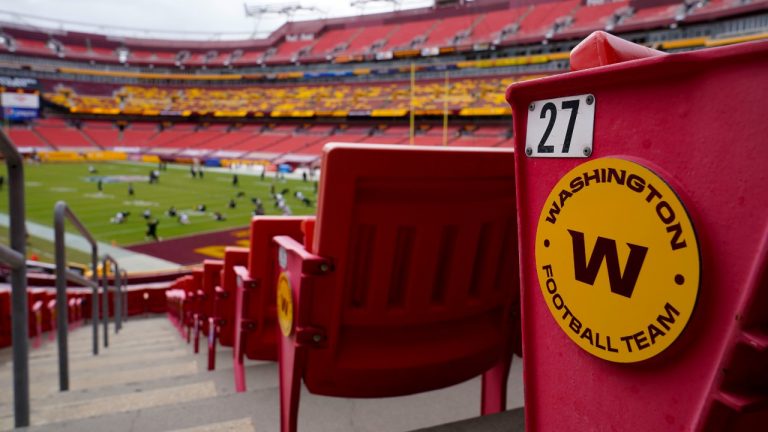 Seats at Fedex Field display the Washington Football Team logo on the seats during pregame warmups of an NFL football game between Washington Football Team and Philadelphia Eagles, Sunday, Sept. 13, 2020, in Landover, Md. (Susan Walsh/AP Photo) 
