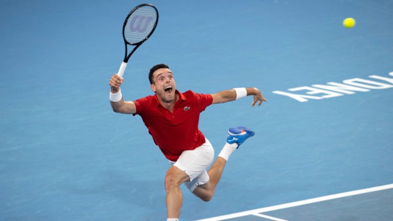 Roberto Bautista Agut of Spain plays a shot against Poland's Hubert Hurkacz during their semifinal match at the ATP Cup tennis tournament in Sydney, Friday, Jan. 7, 2022. (Steve Christo/AP)